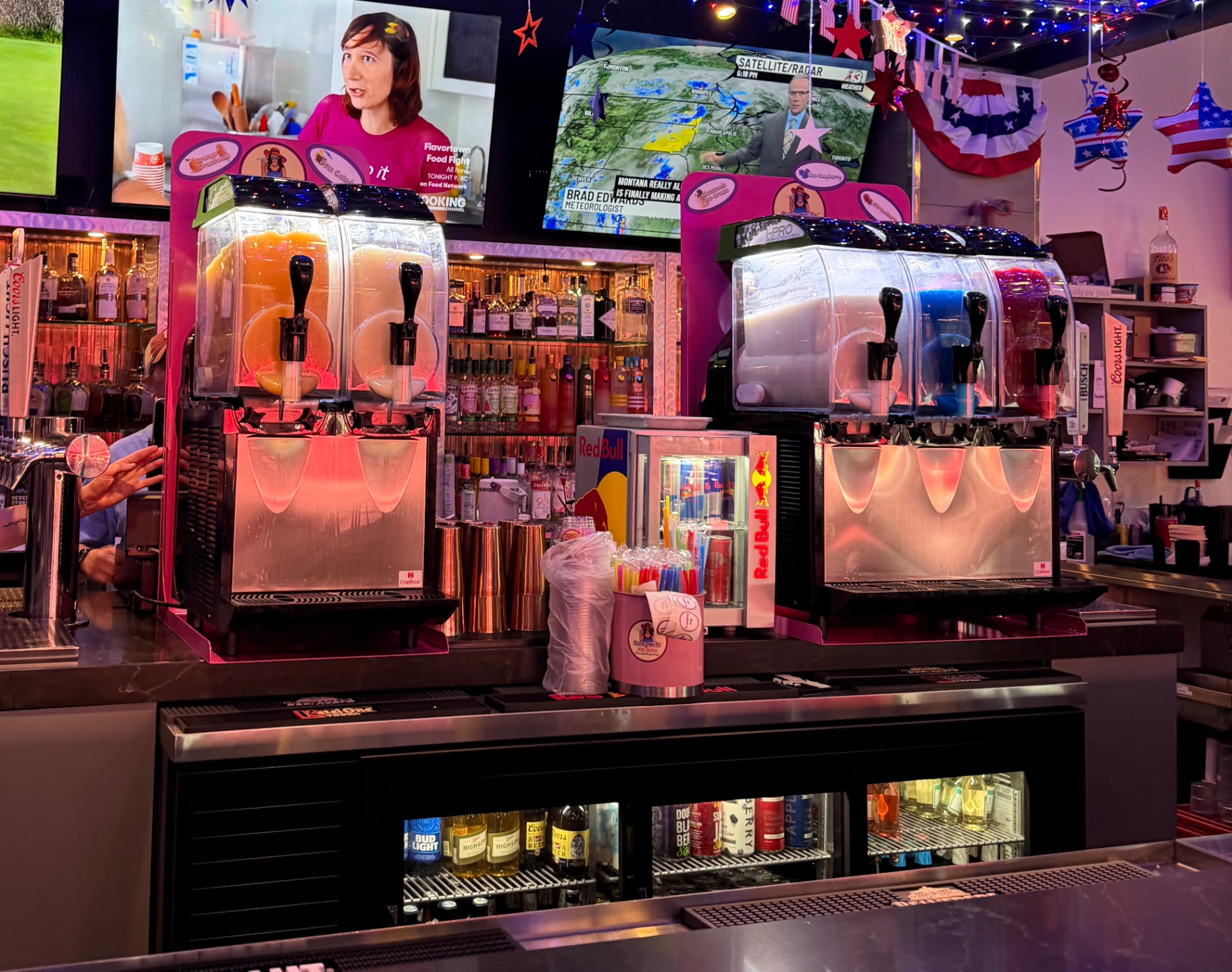 Lucky Wife wine slushie machines lined up on a festive restaurant bar counter